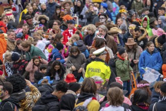 Rose Monday parade in Düsseldorf, police officers on duty at the street carnival, North