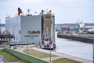 North lock in the overseas harbour of Bremerhaven, the vehicle transporter Durban Highway, under