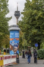 Advertising pillar with 5G mobile phone antenna in the roof of the advertising pillar, over 50 of