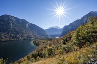 View of the Königssee from the Rinnkendlsteig mountain hiking trail, autumnal forest and