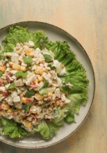 Canned corn salad, with crab sticks, top view, no people