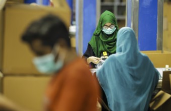 Employees of Inter Market Knit Private Limited producing socks. Lahore, 22.08.2024. Photographed on