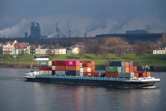 The river Rhine near Duisburg, houses on the Rhine dyke, Laar district, Thyssenkrupp Steel