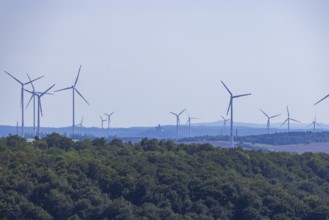 Neukirchen wind farm near Eisenach. with distant view of Wartburg Castle, Nazza, Thuringia,