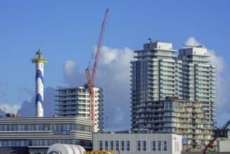 Lighthouse Lange Nelle and flat and apartments of the Oosteroever quarter along the harbour of