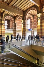 Interior view of Centraal Station, Central Station with flag, Amsterdam, Netherlands