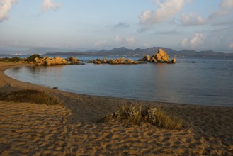 Lonely beach with granite rocks, sunrise, Spiaggia Poltu Manzu, Capo Ceraso, near Olbia, Sardinia,