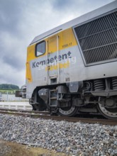 Close-up of a locomotive with the inscription Competent and flexible, track construction, rail