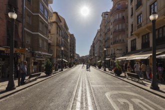 Wide, sunny street in an urban city centre, Granada