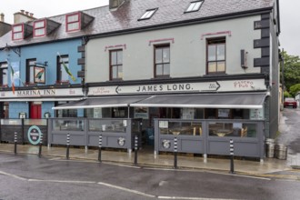 Historic pub front with modern awning, Dingle