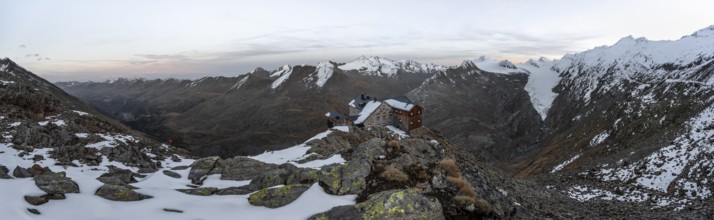 Panorama, Snowy mountain landscape, mountain hut Ramolhaus in autumn with snow, at sunset, view of