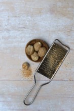 Nutmegs and grater, Myristica fragrans