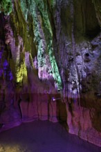 Stalactites illuminated by coloured LED light, stalactite cave, Höllgrotten, Baar, Canton Zug,