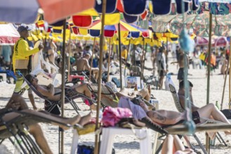 Overtourism in Thailand. Mass tourism on the sandy beach of Patong, the deckchairs are packed