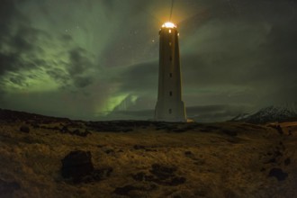 Northern lights or aurora borealis, lighthouse sends light signal, Malarríf, Snæfellsnes Peninsula,