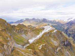 Dramatic view of a rocky mountain landscape with snowfields and valleys, Alpentower, Switzerland,