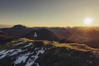 Trail running in autumn on the Jochberg on Lake Walchensee against the wonderful backdrop of the