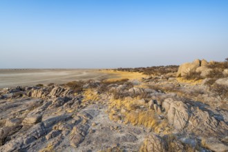 View over round rocks from Kubu Island (Lekubu) to the salt pan, at sunrise, Sowa Pan, Makgadikgadi