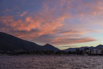 Locarno, Lake Maggiore, clouds coloured by evening light in the background, Canton Ticino,