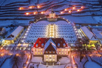 Aerial view of Wackerbarth Castle with castle park, belvedere and vineyards with snow and Christmas