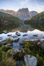 Mountain peaks of the Ötztal Alps reflected in Lake Piburger See, in autumn, near Ötz in Ötztal,