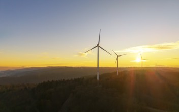 Hilly landscape with wind turbines at sunrise, natural colours and lights, wind farm, Rems Valley,