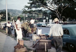 Street traders on pavement opposite Queen's Park Savannah, Port of Spain, Trinidad, 1963