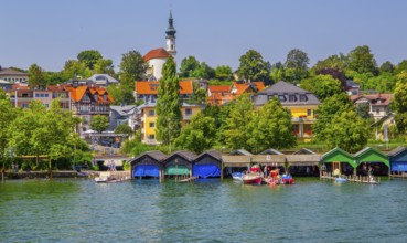 Waterfront with boathouses and St Joseph's Church on the Schlossberg, Starnberg, Lake Starnberg,