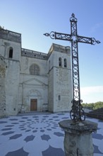 Gothic church Saint-Sauveur with historic city wall and cross, metal cross, floor, pattern, floor