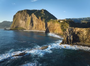 Aerial view of Madeira cliffs coastline landscape on sunrise, Guindaste viewpoint, Madeira island,