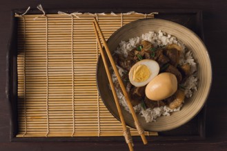 Stewed eggs, with pork belly, and rice, chinese food, homemade, selective focus, rustic, no people