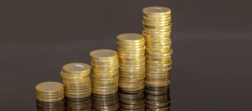 Stacked one-euro coins as a symbolic image for finance, inflation, etc