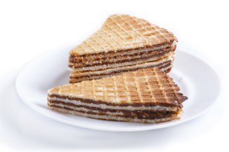 Waffle sandwiches with boiled condensed milk in plate isolated on white background. closeup