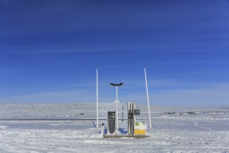 Lonely petrol station in the highlands of Iceland, winter, snow, sunny, Hraunejar, Iceland, Europe