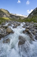 Mountain stream Hornkeesbach, behind mountain peak with snow and glacier Hornkees, Berliner