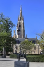 Church of Our Lady and the statue of one of the Four Horsemen of the Apocalypse, Bruges, Flanders,