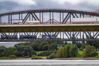 The Beeckerwerth Rhine bridge of the A42 motorway, truck traffic, behind it the Haus-Knipp railway