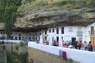 Cafes and shops under rock cave overhang, Setenil de las Bodegas, Cadiz province, Spain, Europe