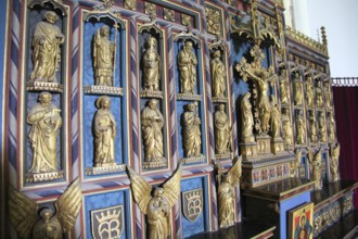 Gilt reredos of saints inside church of Saint Mary, Swilland, Suffolk, England, UK