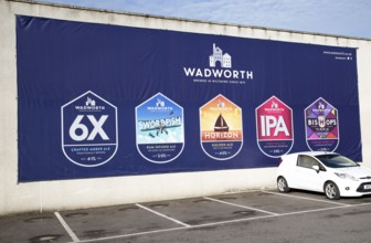 Billboard traditionally brewed beer advertising poster at Wadworth brewery, Devizes, Wiltshire,