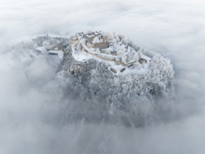 Aerial view of the Hegau volcano Hohentwiel with Germany's largest fortress ruins rising out of the