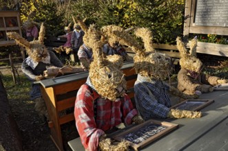 Life-size straw dolls, pupils as Easter bunnies at school, Oberneuching near Erding, Upper Bavaria,