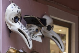 Venetian carnival masks in front of a shop, Burano, Veneto, Italy, Europe