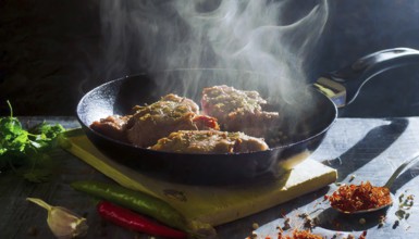 Delicious meat stakes cooked on a pan. Wooden cutting board with spices and oil, AI generated