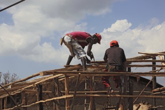 South Ethiopia, two men on a building site, house building, wooden construction, Ethiopia, Africa