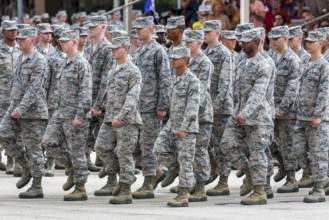 Flight of airmen marching in formation during United States Air Force basic training graduation