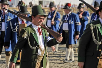 Man with rifle, parade of Bavarian rifle clubs in traditional traditional costume, fairground,