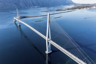 Aerial view of Helgeland bridge, connecting Sandnessjøen with the norwegian mainland, fishing boat