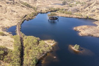 Aerial view to the west over lake Loch Eilt with island Dumbledore's Grave, Harry Potter film