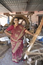 Indian worker, 59 years old, in the spinning mill of the Labourers Coir Mats and Mattings